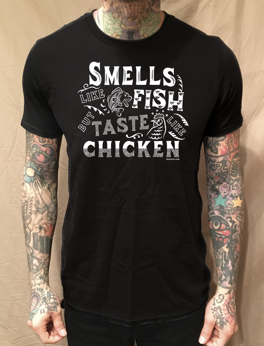 SMELLS LIKE FISH BUT TASTE LIKE CHICKEN BLACK TEE - cristocatofficial